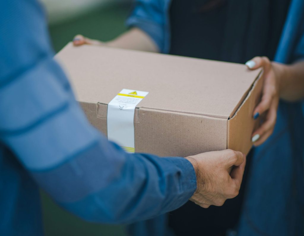 person giving brown box